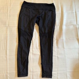 Black textured size 10 Lululemon leggings with pockets on the sides and zippers
